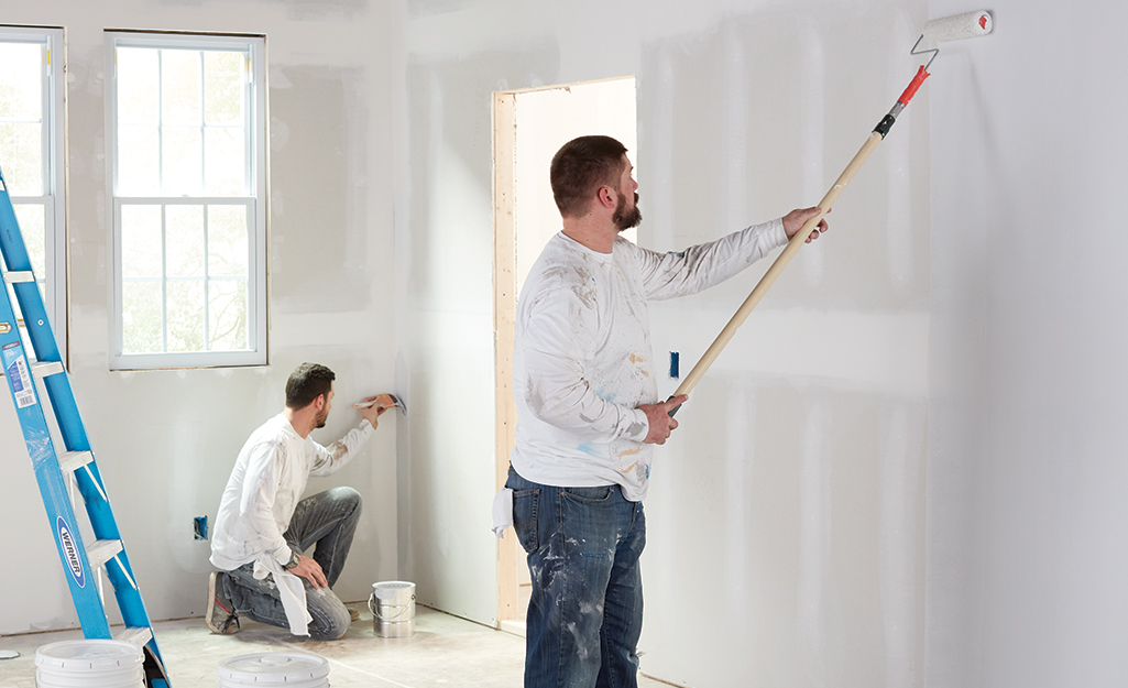 Wall preparation and priming before wallpaper installation